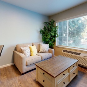 a living room with a couch and a table