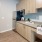 a kitchen with wooden cabinets